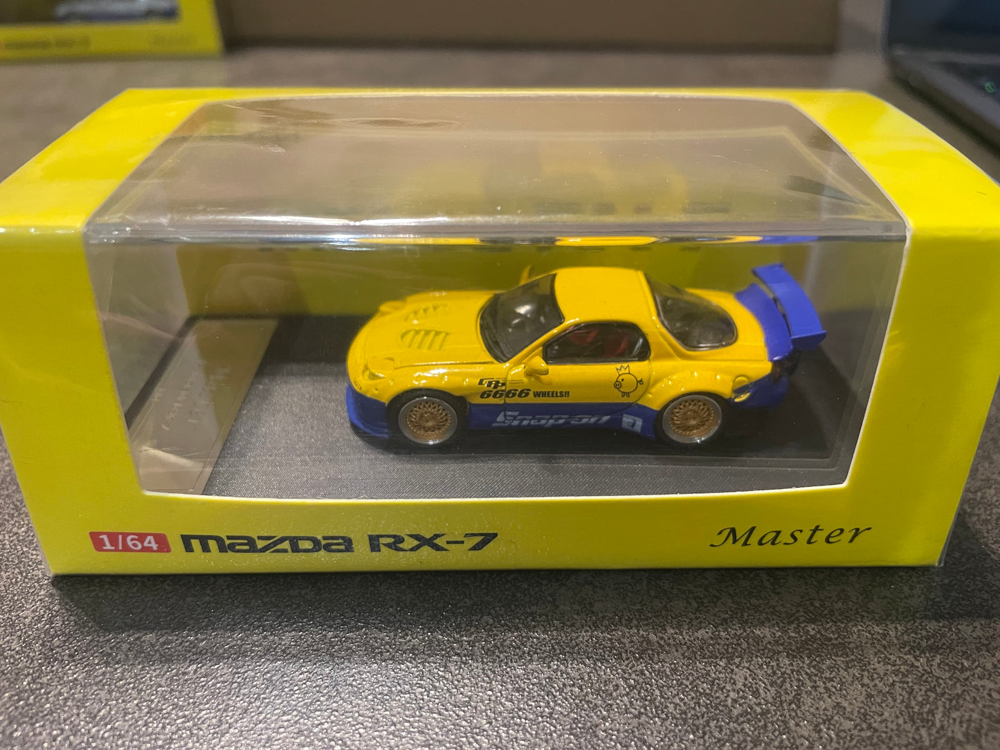 Master - 1/64 Mazda RX7 Rocket Bunny. Hood Opened+GT Wing. Filp Lights diecast model car - Blue Yellow