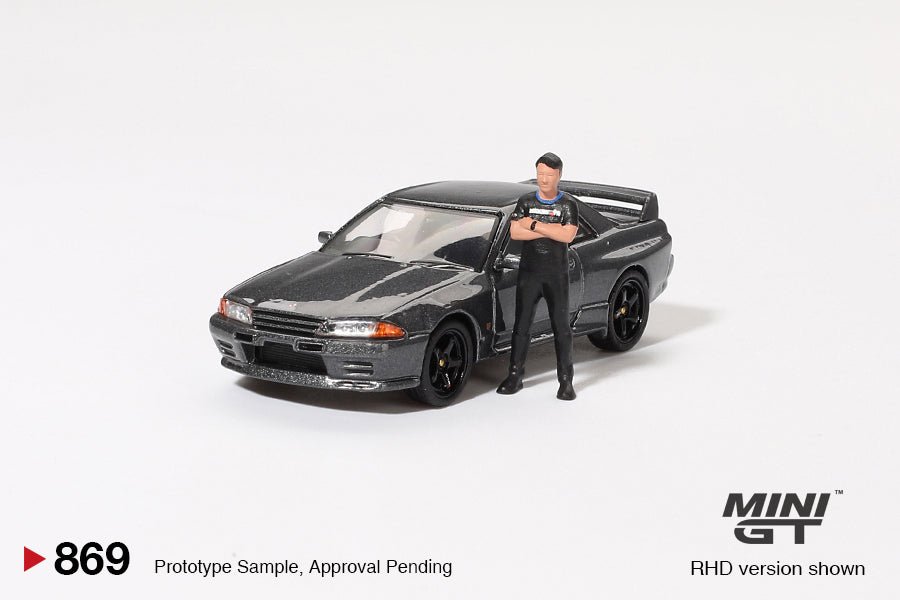 [PREORDER] Mini GT - 1/64 Nissan Skyline GT - R R32 Nismo Gunmetal with Matsuda Figure Tsugio Matsuda Collection - MGT00869 - R - MODEL CARS UKMODEL CAR#INNO64##TARMAC##diecast_model#